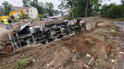 Cement truck rolls over at construction site in Taunton